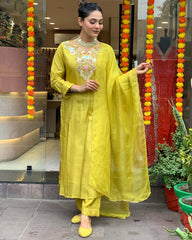 Radiant Charm: Yellow Chanderi Silk Suit with Organza Dupatta.