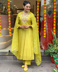 Radiant Charm: Yellow Chanderi Silk Suit with Organza Dupatta.