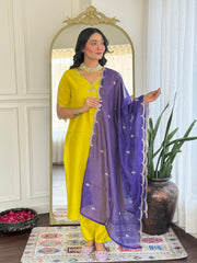 Salwar love Festive Brilliance: Vibrant Yellow Kurta Set with Mirror Work & Rich Purple Sheer Dupatta .